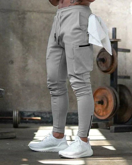 Men's flexible fit cargo pants in a versatile design, featuring zippered pockets for secure storage, ideal for outdoor activities and everyday wear. 0